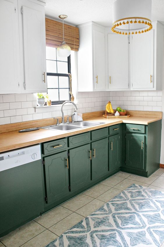 70 a two tone farmhouse kitchen with white and green cabinets, butcherblock countertops and a white subway tile backsplash