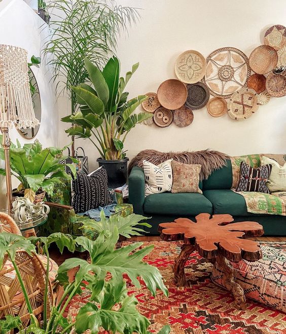 a bright boho living room with decorative baskets, pretty furniture and lots of potted plants to feel fresh