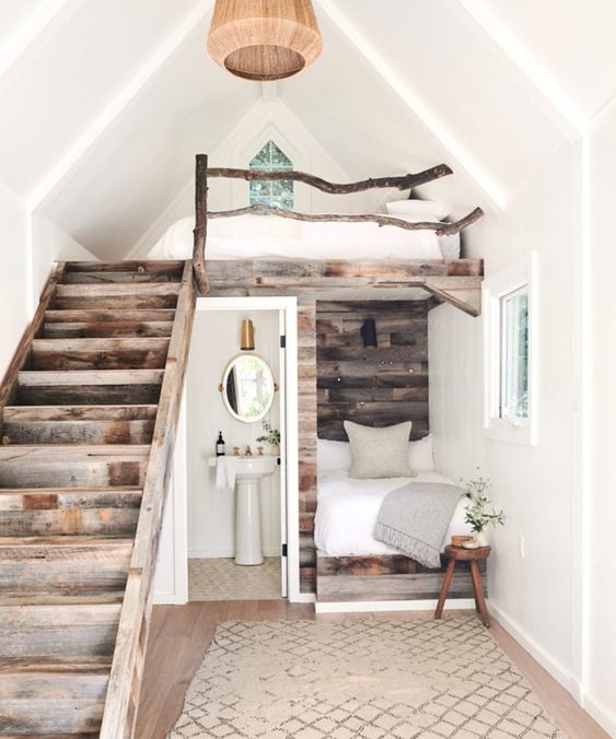 a little rustic apartment with a two bedrooms - a usual and a loft one, a bathroom and a pretty reclaimed wood staircase