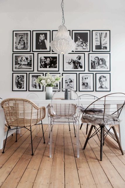 a chic gallery wall with mismatching black frames that differ in size and shape in each row and look bolder