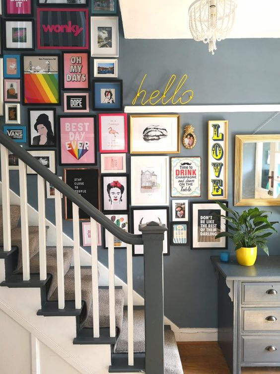 a colorful gallery wall with mismatching frames and bold pop art is a creative idea to add fun to the space
