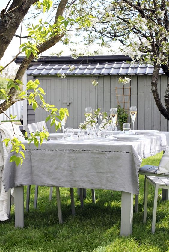 an outdoor dining zone in neutral shades