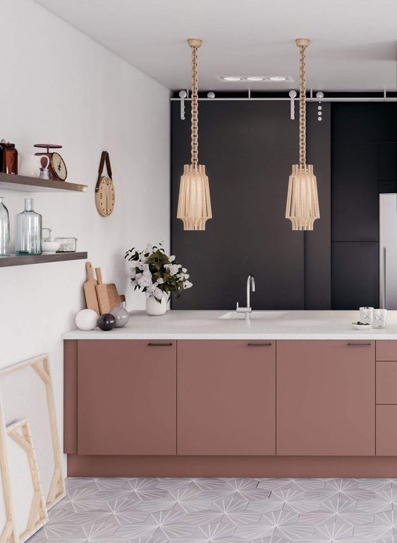 a sophisticated kitchen with a black wall, mauve cabinetry with white coutnertops, beautiful lamps on chain