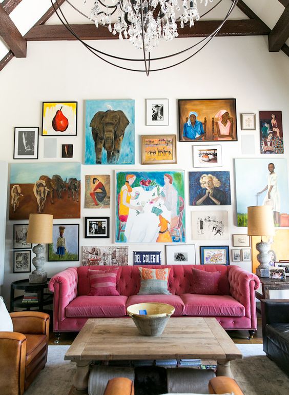 a super bright gallery wall with bold artworks with frames and without them, in bold colors and with a free form for a creative touch