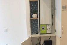 07 a built-in storage cabinet with shelves and storage units can hide a wi-fi router or some other stuff and declutter your space