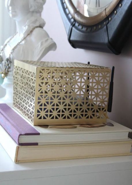 a laser cut metal box is a lovely idea to hide your wi-fi router and it looks nice, so it won't spoil your interior