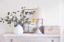 15 a lovely vintage-inspired interior in white, with a whitewashed woven box that hides a router, which is a very stylish idea
