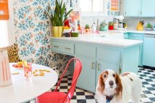 a cute retro kitchen with a botanical wallpaper