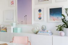 a home office with a cheerful gallery wall