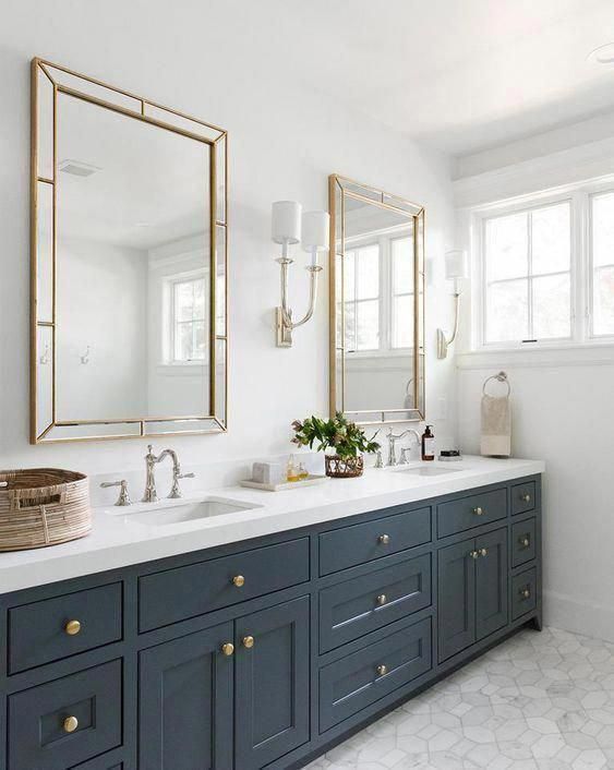 an elegant graphite grey farmhouse bathroom with a double sink and mirror, with a basket for storage
