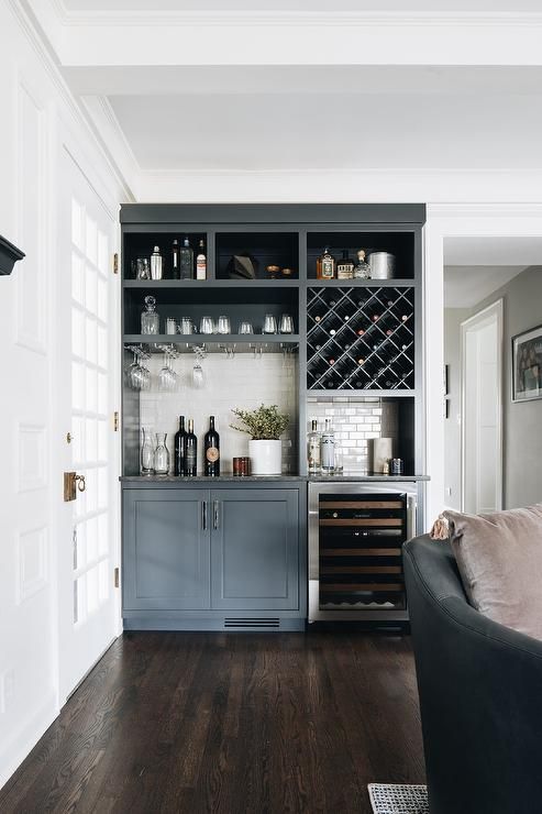 a gorgeous home bar made of kitchen cabinets
