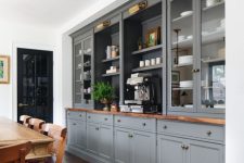 36 a formal farmhouse dining room with a whole wall taken by grey kitchen cabinets, a vintage wooden dining set