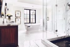 a spacious bathroom with a glass-enclosed shower space