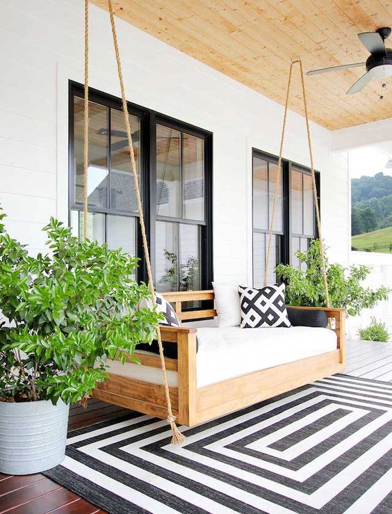 a daybed is the best addition to a porch