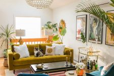 04 a vibrant living room in bold colors, with a mustard sofa, navy chairs, a bold abstract rug, potted plants and a cool bar cart