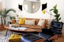 21 a stylish mid-century modern living room with a leather sofa, a lovely oval coffee table, a black lounger