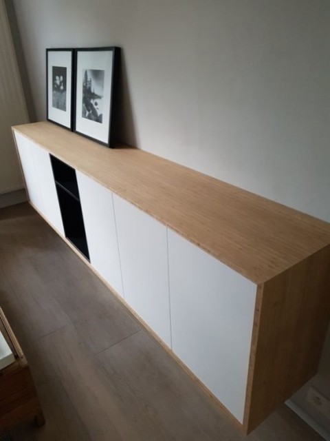 a chic contemporary floating credenza of IKEA Metod cabinets and Tutema cabinets plus a light-stained wooden cover