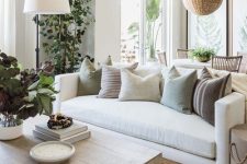 36 a neutral and chic living room and dining space dotted with amazing potted greenery and trees items is a very fresh idea