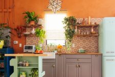 an orange kitchen design in eclectic style