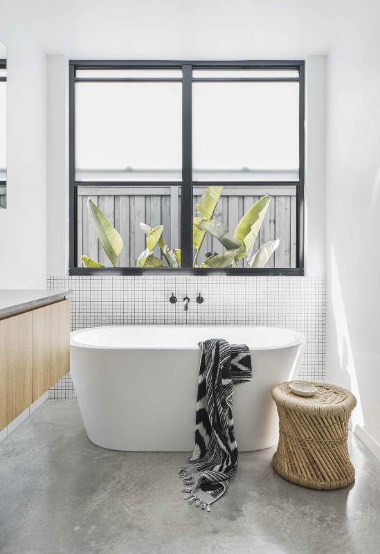 a contemporary bathroom design with concrete floor