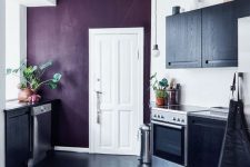 a stylish kitchen with a touch of purple
