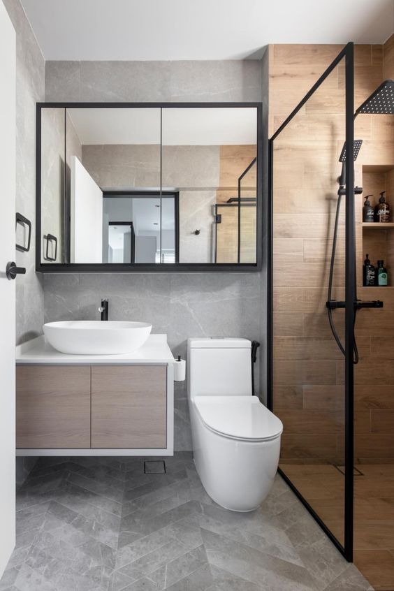 a small contemporary bathroom with a floating vanity, a shower space clad with wood tiles, a chevron floor, black touches for a contrast