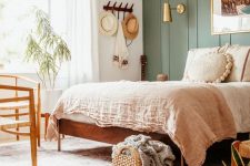 a cozy boho bedroom with a bold accent wall