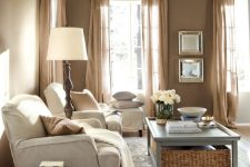 a cozy farmhouse living room design with a taupe color scheme