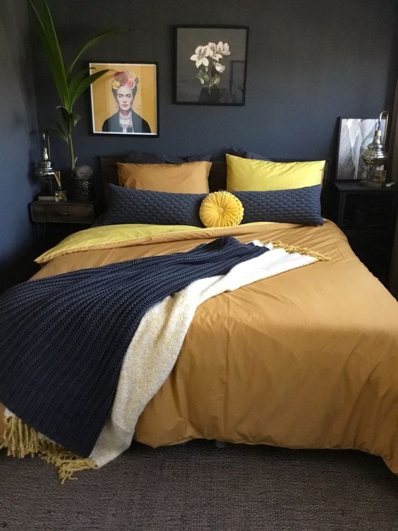 a moody black-yellow bedroom design