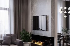26 a refined modern living room with a taupe sofa, curtains and a fireplace unit, a black coffee table and a marble accent wlal