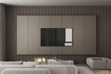 29 an ultra-minimalist living room with taupe wooden slab walls, a tan paneled accent with a TV, an open fireplace, neutral seating furniture