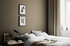 a cozy scandinavian bedroom with taupe walls