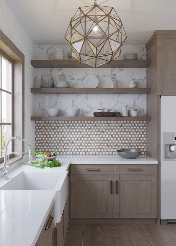 a refined taupe kitchen with a penny tile backsplash, open shelves, white stone countertops and a faceted pendant lamp is chic