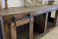 a rich-stained two dog kennel with a sliding door doubles as a console table is a very cool idea for an industrial space