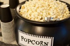 02 a black cauldron with popcorn is a cool way to serve this treat and it’s very Halloween-inspired and cool