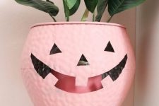 23 a pink jack-o-lantern cauldron is a lovely cover for a planter or a bowl to serve something and it will do for many Halloween parties