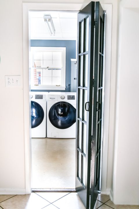 a black frame and glass folding door to the laundry is a great idea - it's a comfy idea to go for and it doesn't make your space smaller