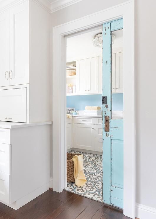 a blue shabby chic glass pocket door is a cool idea for a shabby chic, vintage or farmhouse space and adds a bit of color