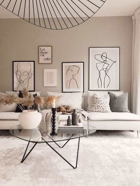 a living room with a free-form gallery wall