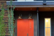 a stylish modern orange metal front door with a house number is an ultimate solution for a mid-century modern house