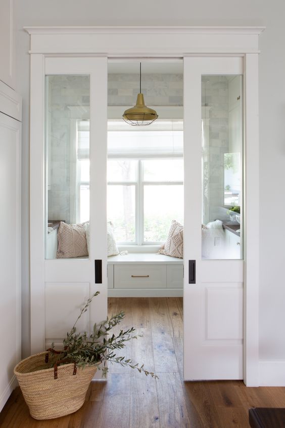 elegant white and glass pocket doors are ideal for separating spaces with style and still let a lot of light in