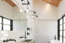 large skylights here keep the bathroom private and personal while filling it with light