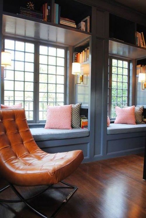 two cozy reading or just sitting nooks at the windows with bookshelves on the walls and over them are perfect