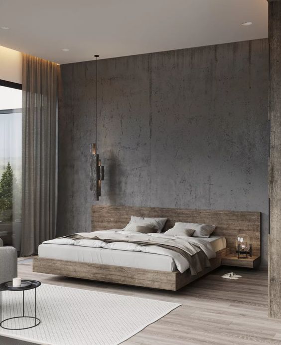a sophsticated minimalist bedroom with an aged metal accent wall, a light-stained floating bed with built-in nightstands, neutral bedding and a pendant lamp