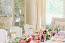 11 a lovely glam Thanksgiving tablescape with pink, blush, red velvet pumpkins, greenery, blush and white plates, gold cutlery and glasses with gold rims