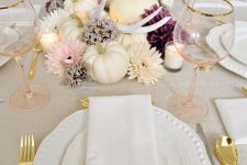 14 a lovely glam Thanksgiving tablescape with wihte pumpkins, antlers, blush, white and purple blooms, candles, white porcelain and blush glasses
