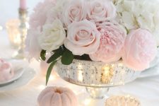 15 a refined and glam Thanksgiving tablescape with chic plates, neutral linens, blush pumpkins, blush and white florals and some lights and candles