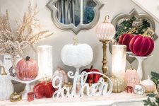 22 a lovely glam Thanksgiving console table with fuchsia, blush, white and gold pumpkins, calligraphy, candles and blooming branches is wow