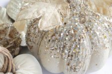 28 glam Thanksgiving pumpkins decorated with pearls and sequins, with gilded leaves and brooches is a lovely idea for fall, too