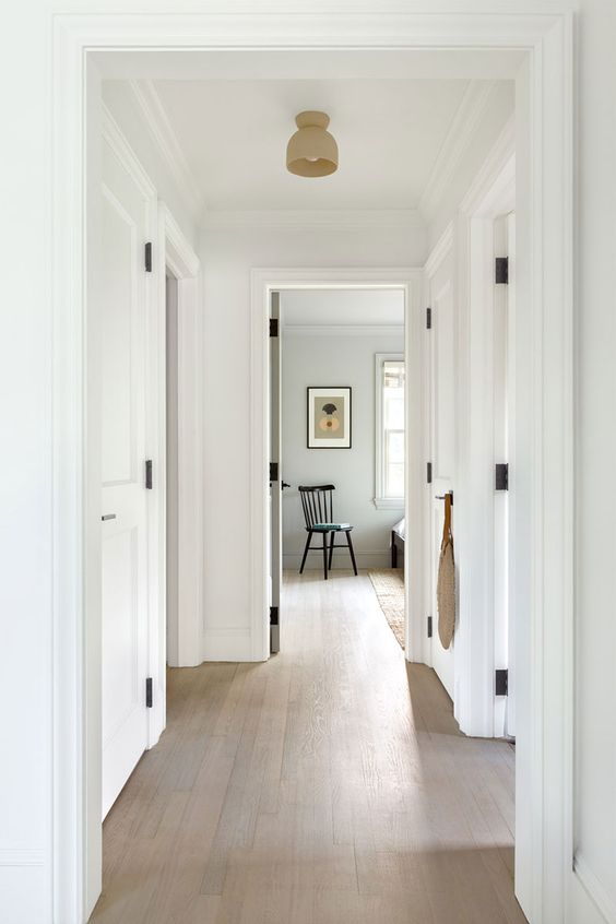 an all neutral space with crown molding covering the doorways is a very cool solution for a modern or Scandinavian space